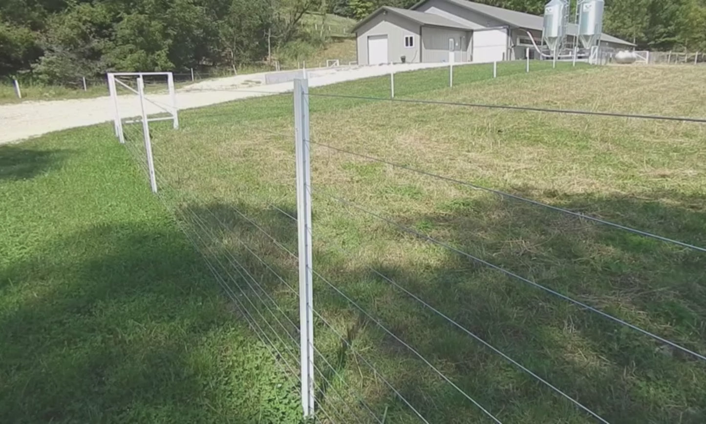 10-wire high tensile electric fence installation example with Timeless Fence System Rigid PVC Fence Posts.